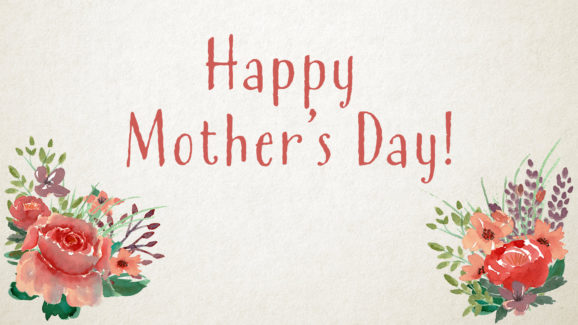 "Happy Mother's Day" worship slide with textured background on floral decorations on the bottom corners